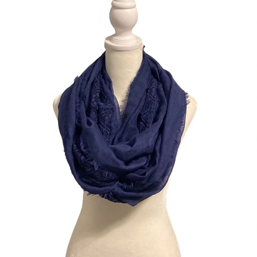 Sheer lightweight navy lace accent scarf. Raw fridge hemline
